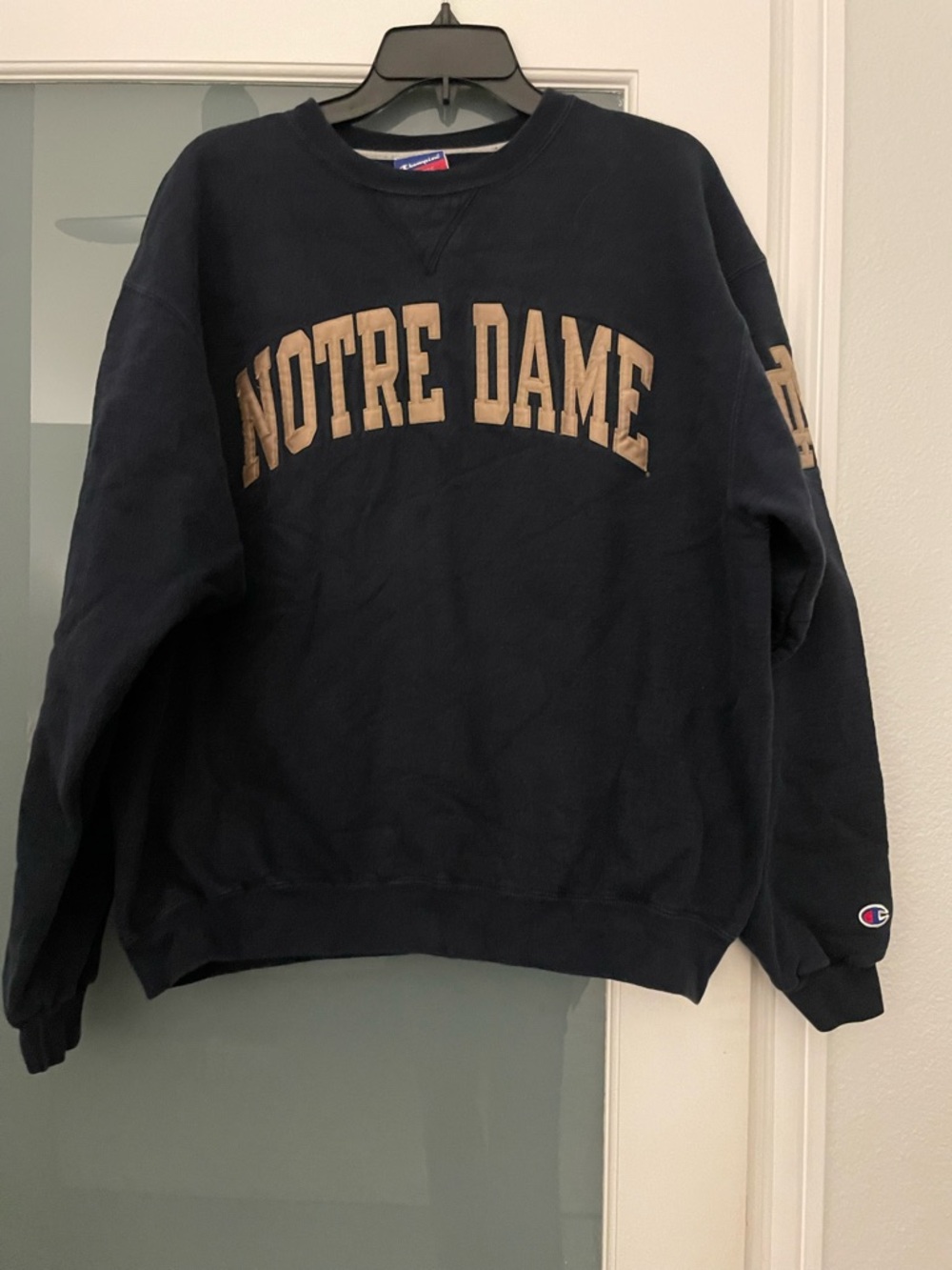 Champion Navy Sweatshirt with Red and White Tag Detail